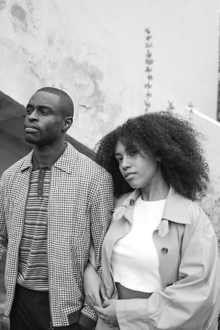 Woman With Afro Hair Beside Man In Plaid Jacket