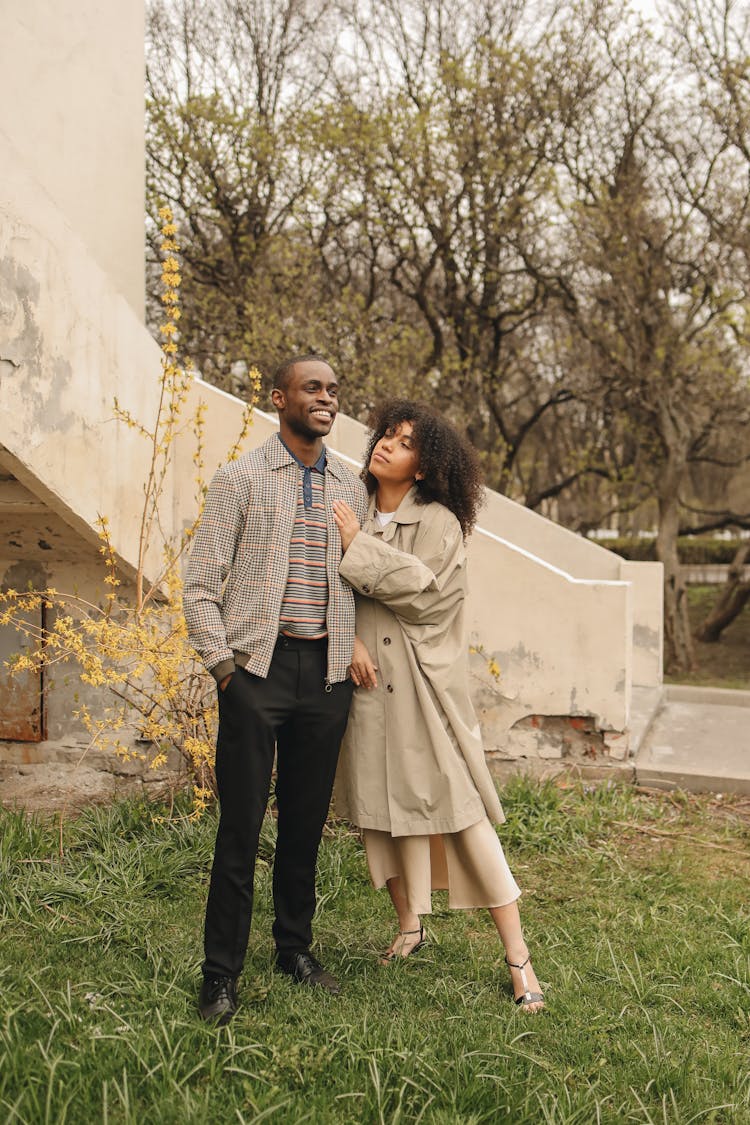 A Romantic Couple Standing Outside