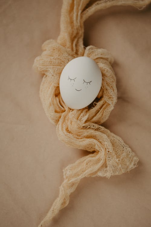 Close-Up Shot of an Egg Covered with a Textile