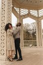 Man and Woman Inside a Rotunda in a Park