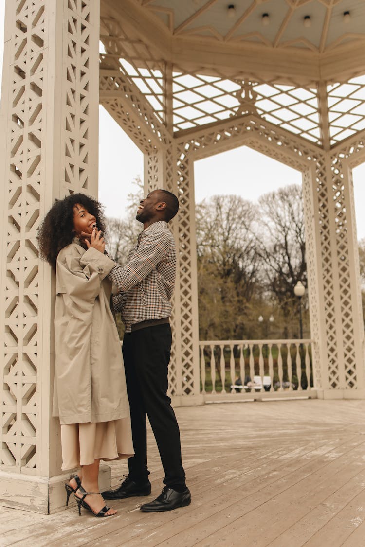 Man And Woman Inside A Rotunda In A Park