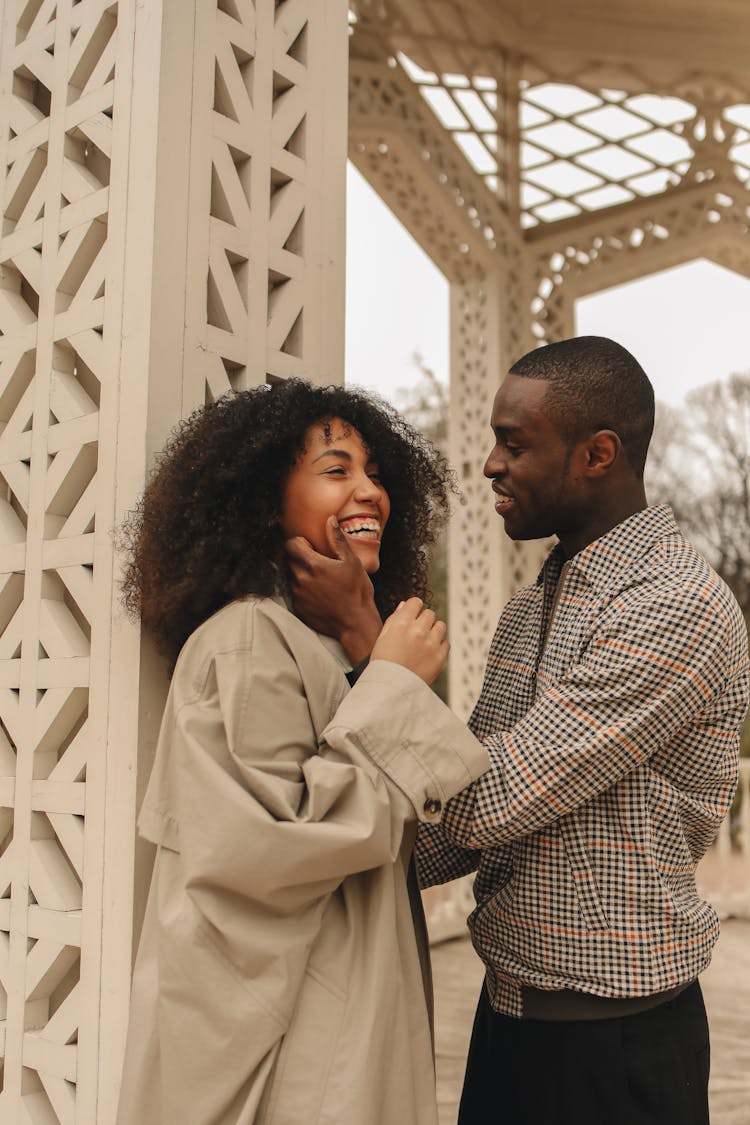 Man Holding The Face Of A Woman