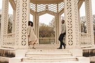 Man and Woman Leaning on a White Rotunda