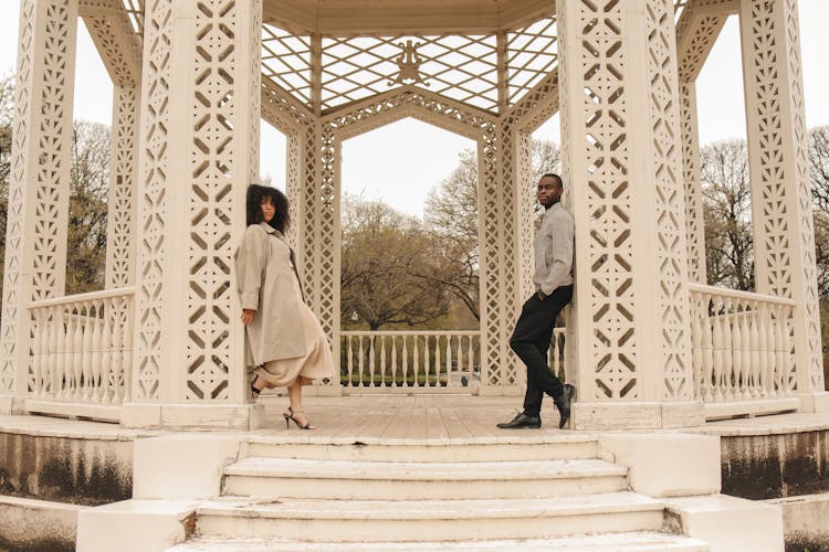 Man And Woman Leaning On A White Rotunda