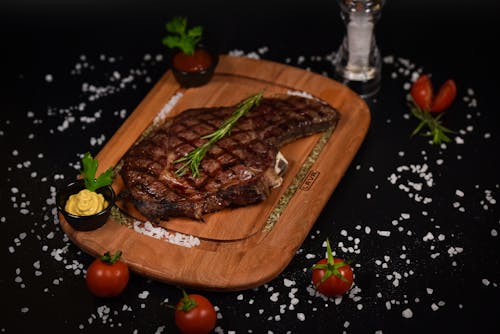 Grilled Meat on Brown Wooden Chopping Board