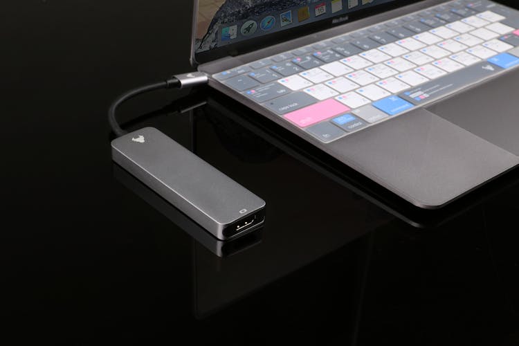 A USB Hub Plugged Into A Laptop