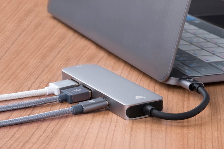 A USB Hub Plugged Into A Laptop