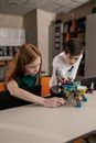 Boy and Girl Playing with Robot