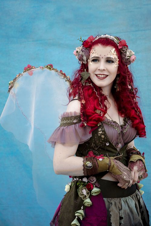 Free A vibrant portrait of a woman in creative fantasy cosplay with floral details. Stock Photo