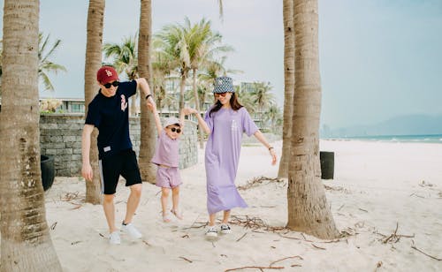 Joyful family having fun on beach