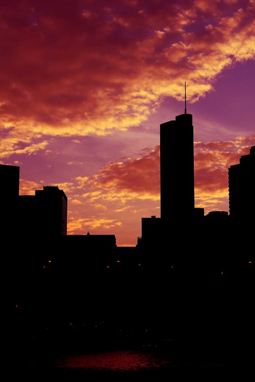 Silhouette of City Buildings During Sunset