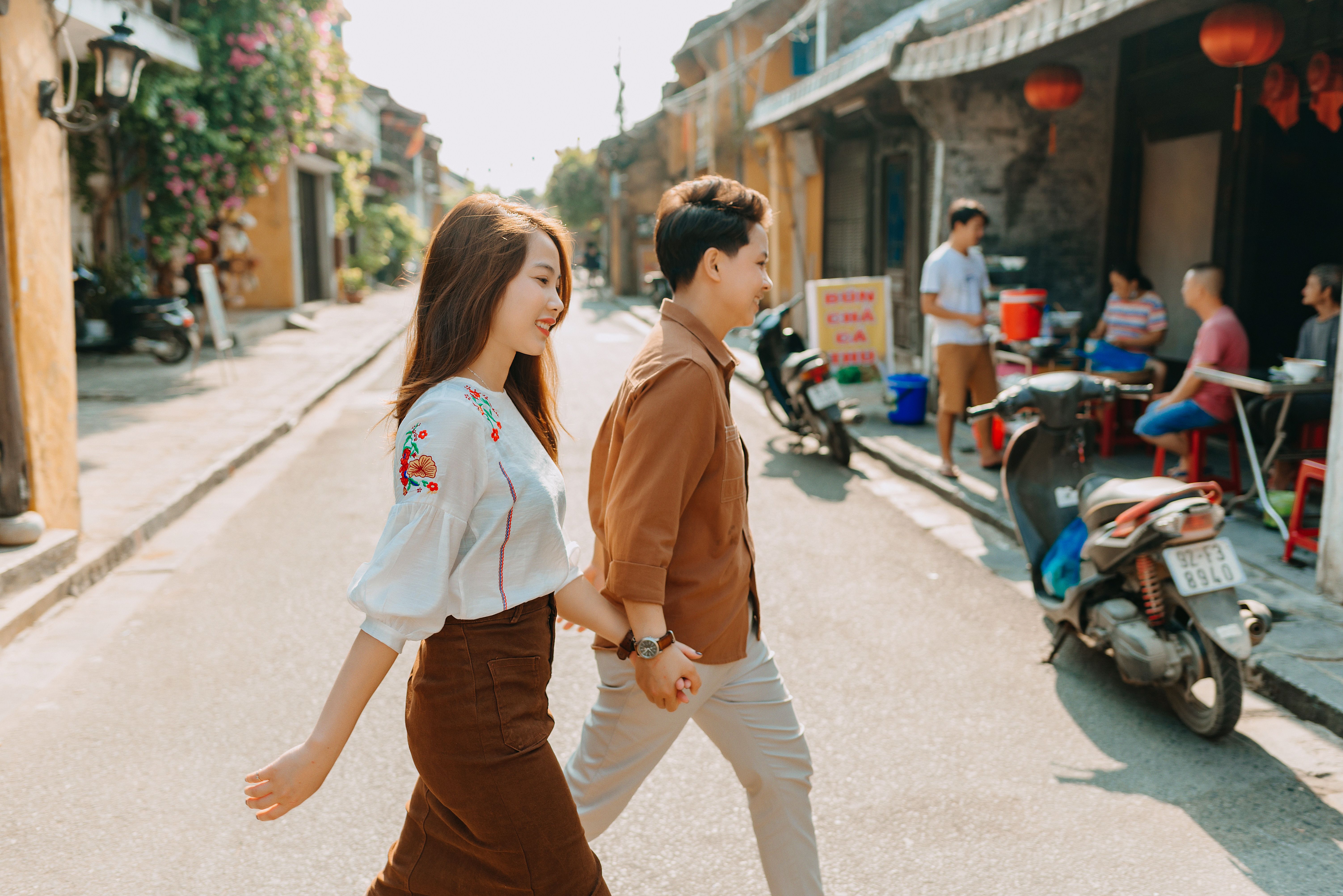 A Couple Holding Hands while Walking · Free Stock Photo