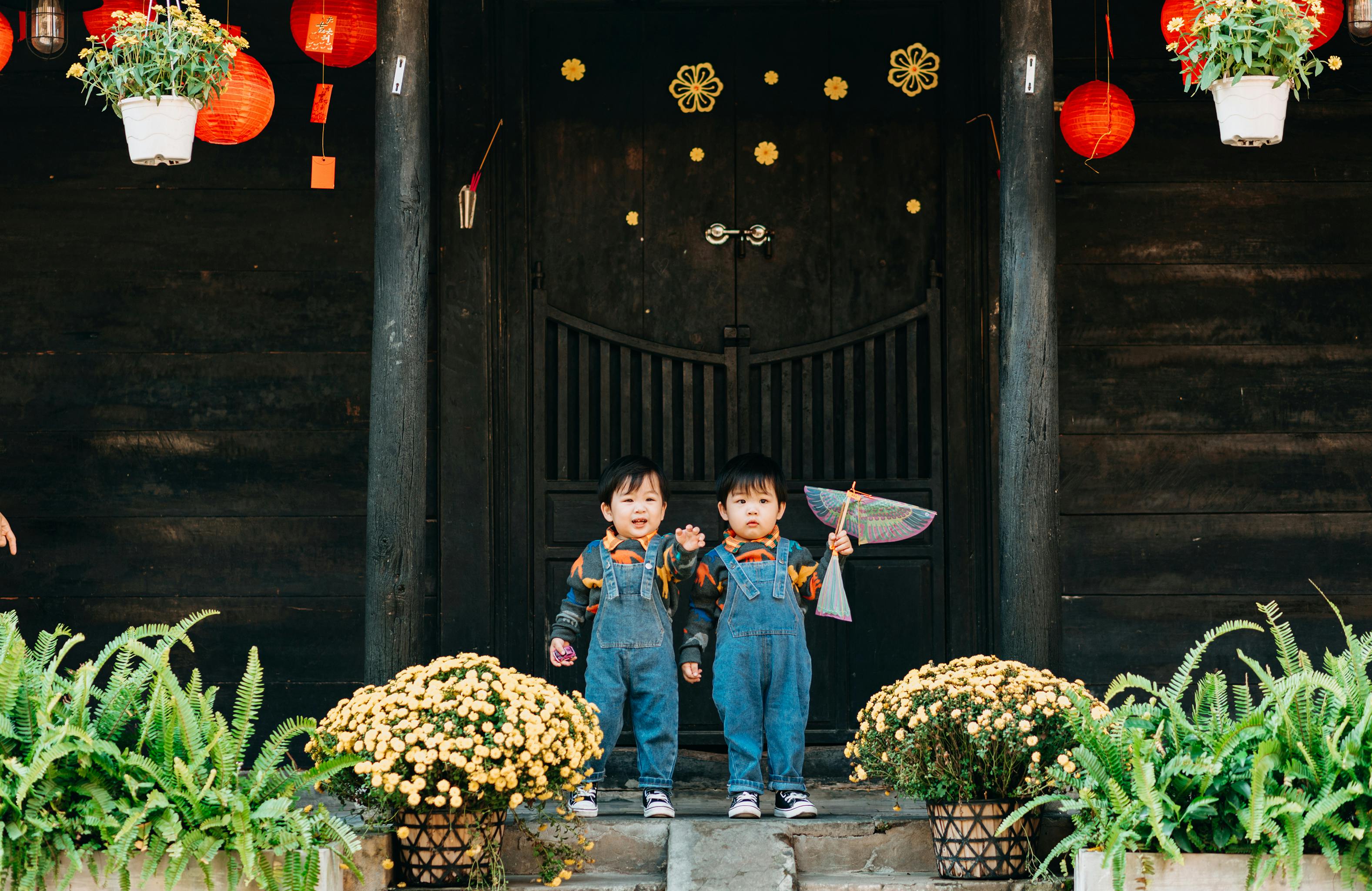 children wearing denim jumpers