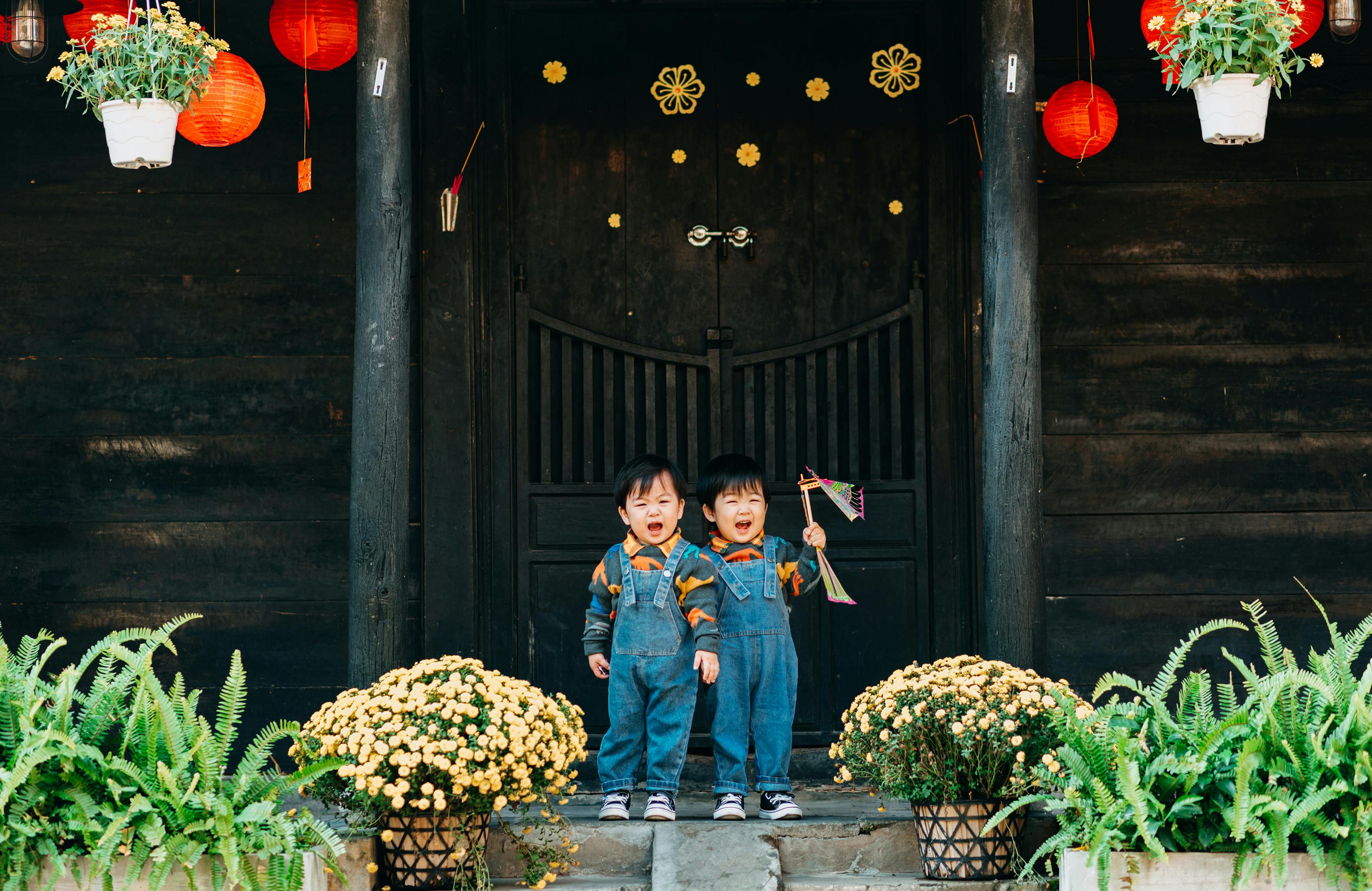 children wearing denim jumpers