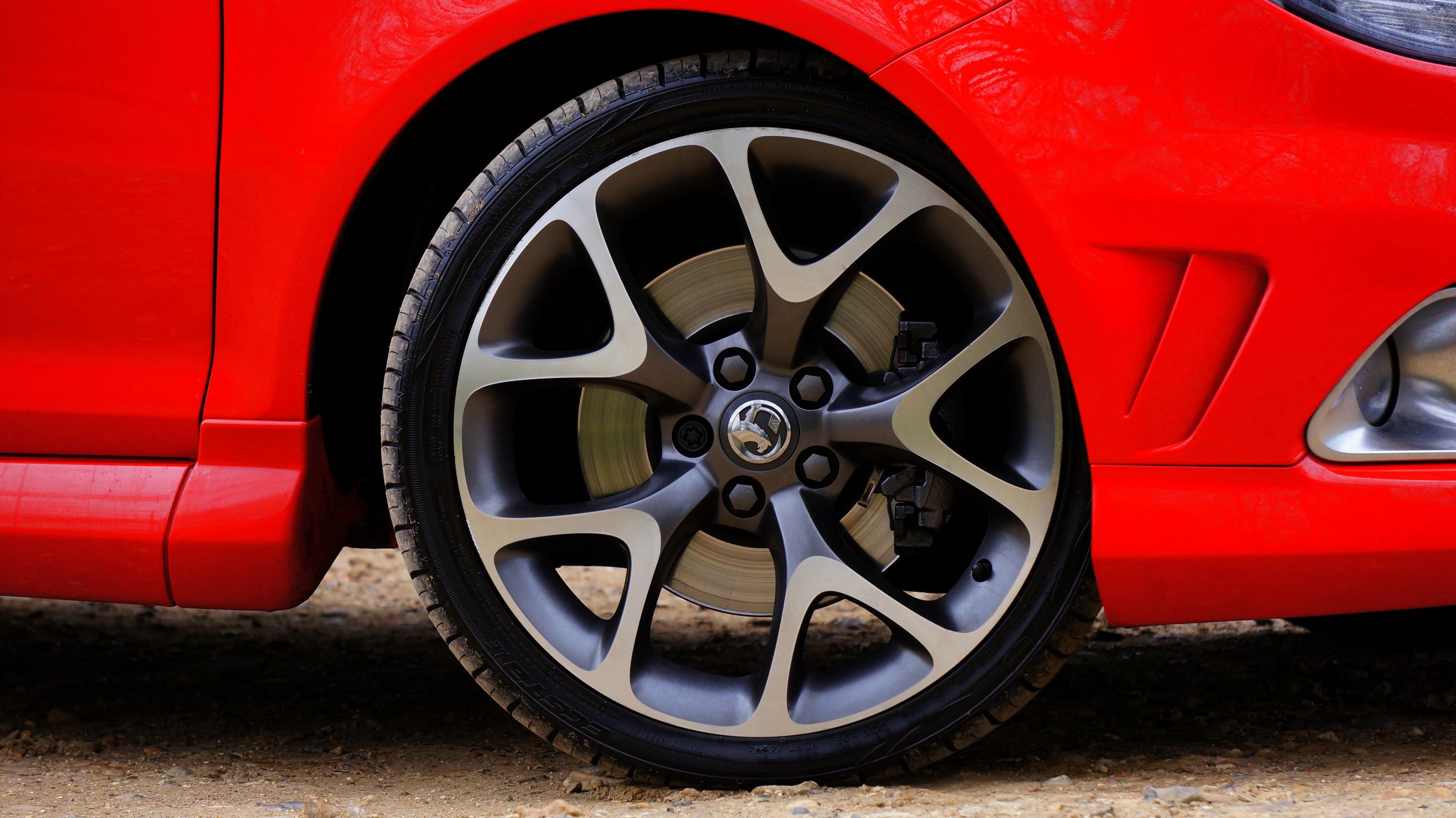 A Gray Alloy Rim on a Red Car · Free Stock Photo