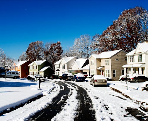 Free Snow Pathway Near at Houses Stock Photo
