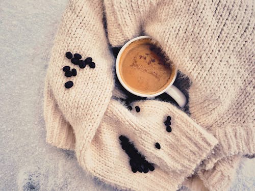 Free White Ceramic Mug on Beige Knit Textile Stock Photo