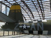 A Gray Fighter Jet Parked Inside Steel Parking Garage