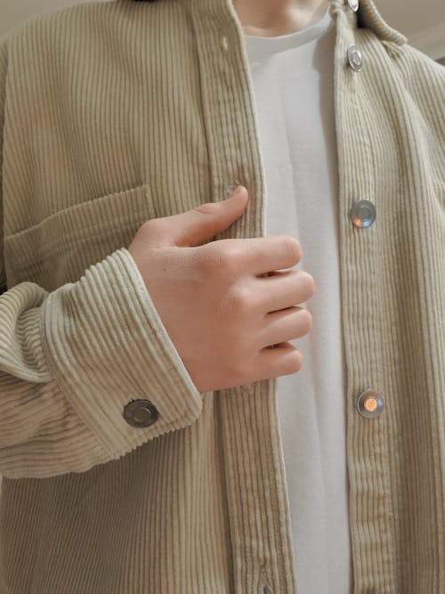 Person in Brown Button Up Long Sleeve Shirt