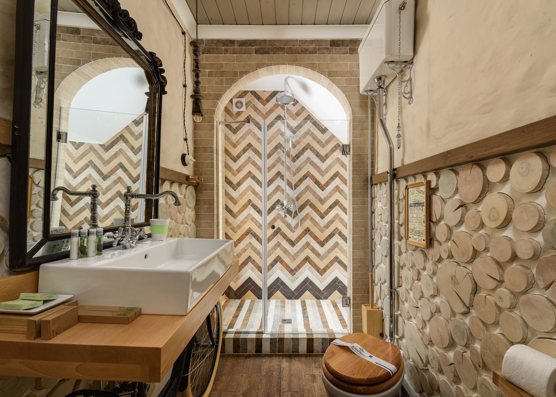Bathroom with directional herringbone tile and natural materials