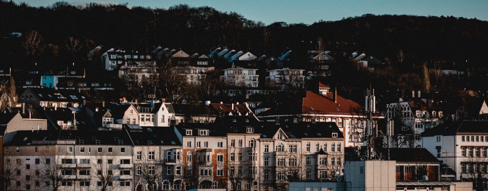 A picturesque view of urban architecture in Wuppertal, Germany, under a vibrant sky.