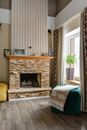 Black Fireplace in Front of White Window Curtain