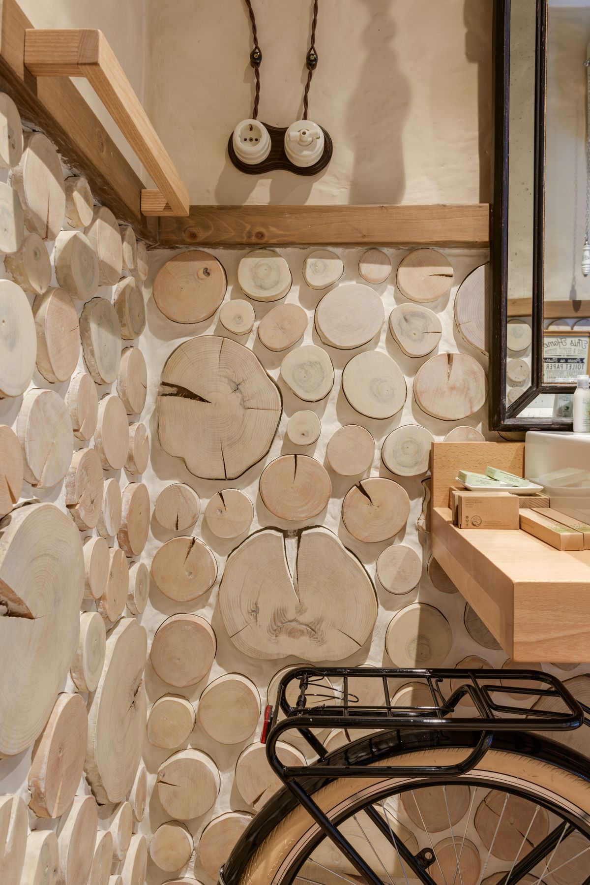Wood slice craft ideas with a wall covered in mounted wood slices of many sizes