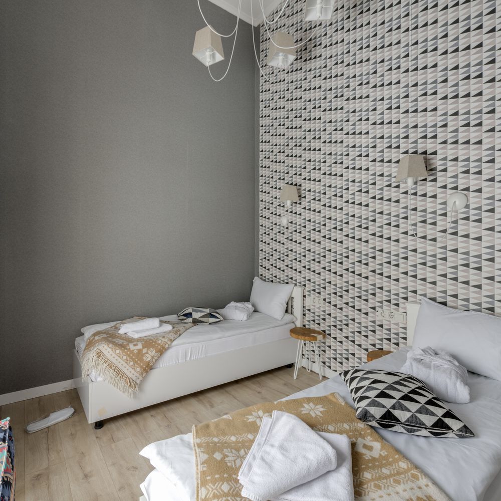 Wallpapering in Brentford — dust sheets down and the room fully protected