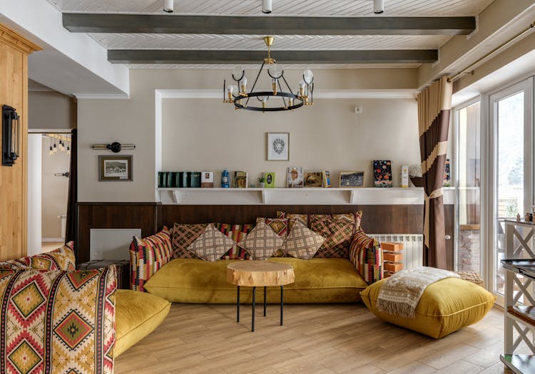 Yellow And Printed Sofa On Wooden Floor