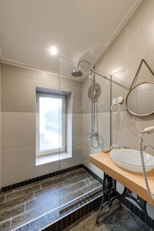Free Elegant bathroom design featuring a modern glass shower and stylish fixtures. Stock Photo
