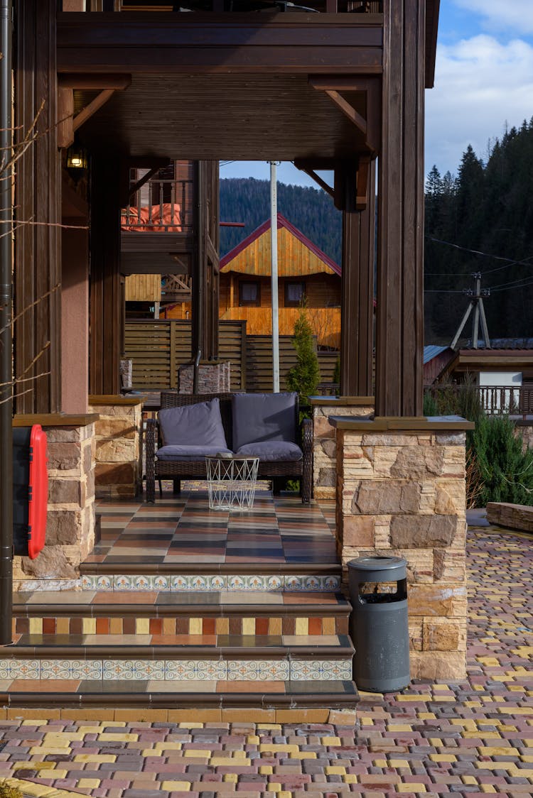 Brown House Porch With Outdoor Furniture