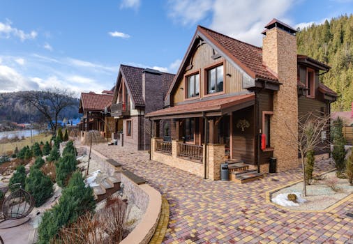Beautiful wooden chalets set in a tranquil mountain landscape, showcasing elegant architecture.