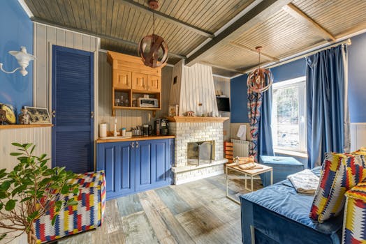 Charming rustic living room with blue accents and fireplace.
