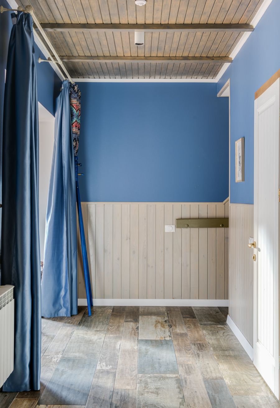 The same room restored with a clean blue painted finish