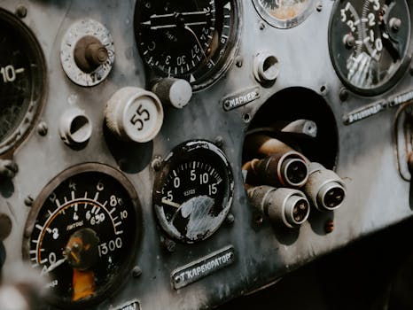 Detailed view of an old aircraft's control panel with gauges and dials.
