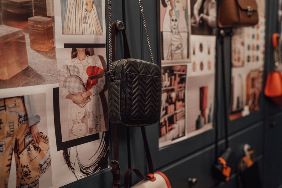 Finished leather bags hanging in a creative workshop