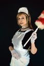 Charming woman in housemaid costume