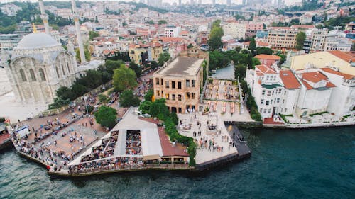 Aerial View of City Buildings Near Body of Water