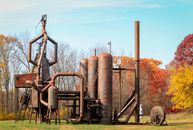Brown Metal Tank on Green Grass Field