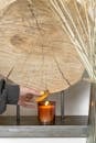 Person Closing the Lid of the Candle