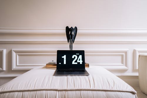 A Laptop Displaying Clock at 1:24
