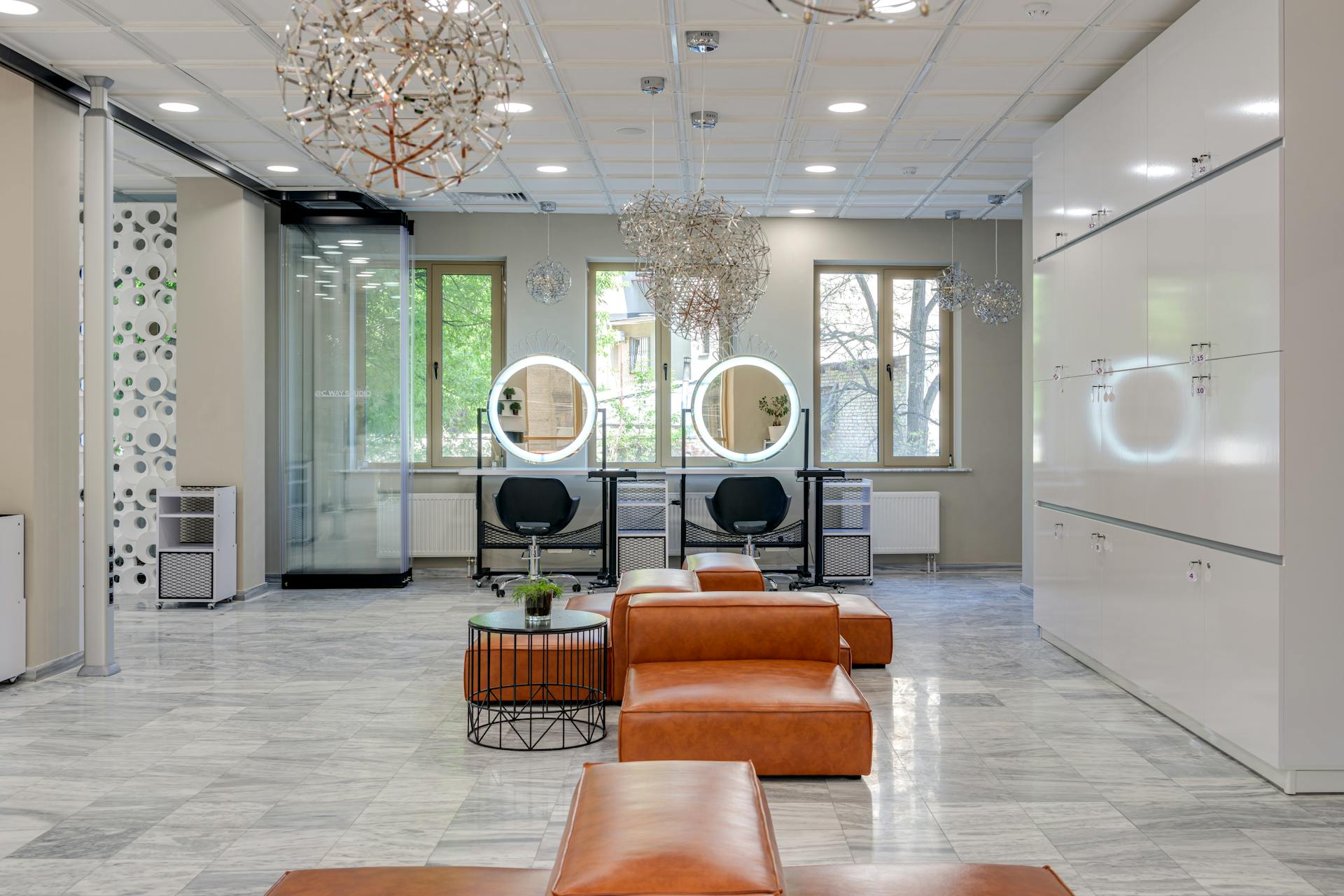 Spacious and elegant beauty salon with chic design elements and ample natural light.