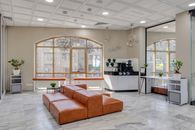 Brown Couch on White Ceramic Floor Tiles
