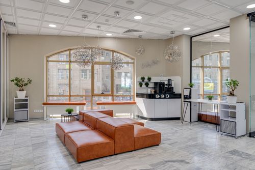 Free Elegant beauty parlor interior featuring a leather couch and contemporary design elements. Stock Photo