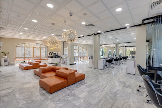Elegant and cozy modern salon with ample natural light and stylish decor.