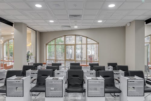 Black Leather Chairs and White Tables