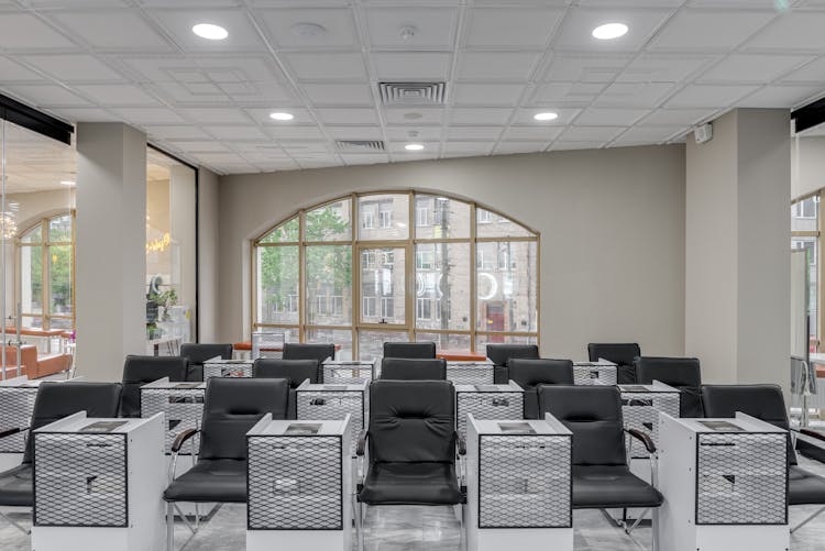 Black Leather Chairs And White Tables