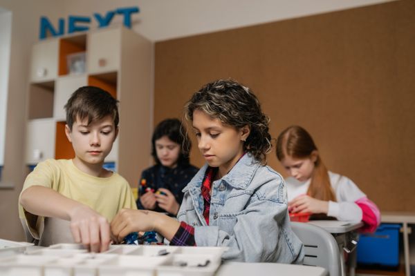 Students building robotics devices