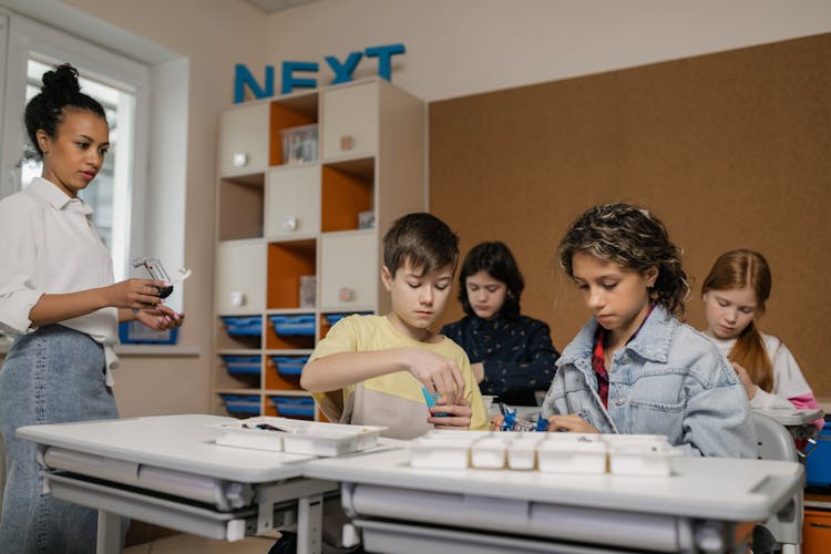 Group Of Students Making A Science Project