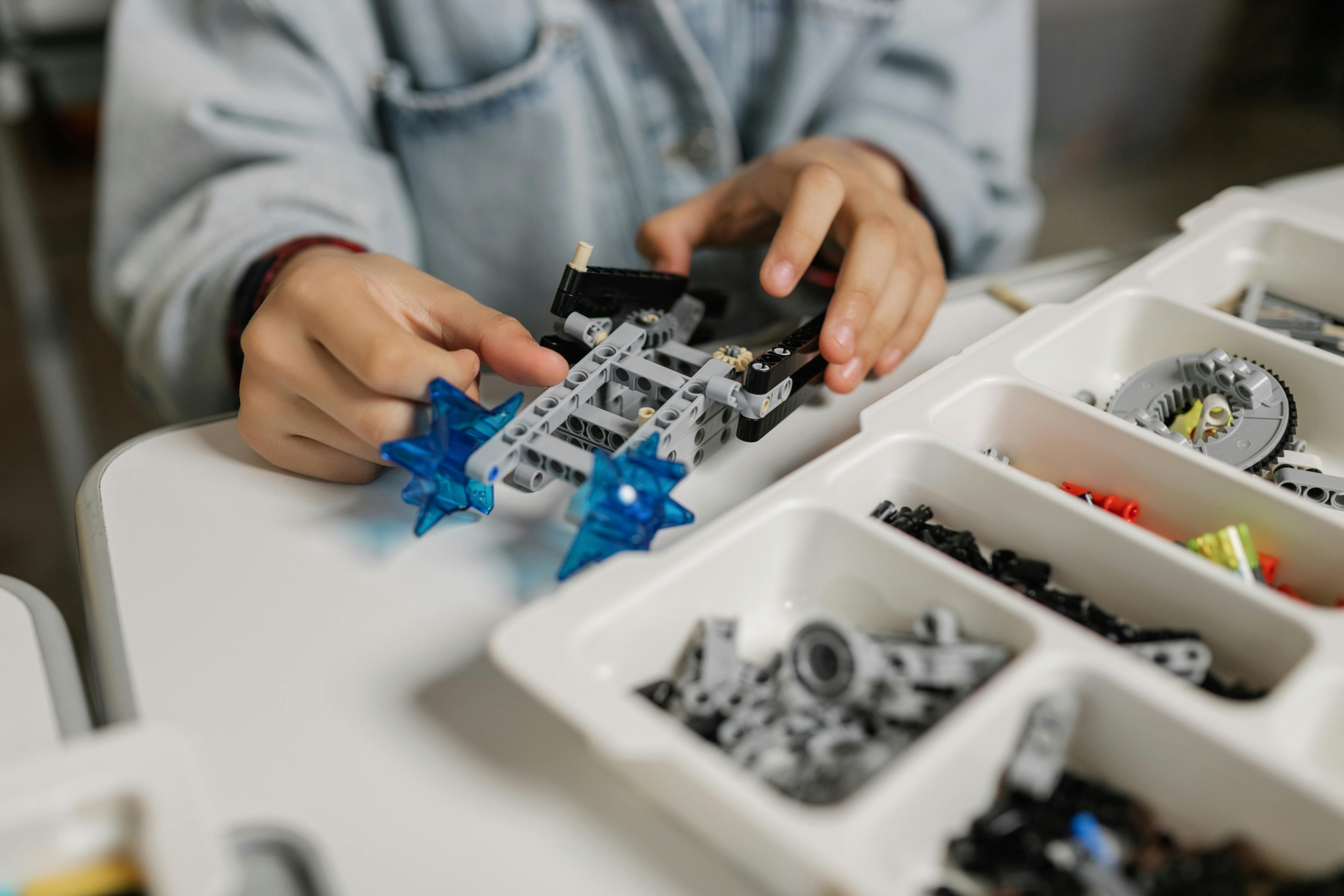 Child Placing Toy Blocks · Free Stock Photo